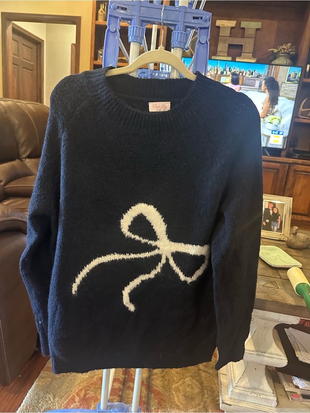 Pink Lily Black Crewneck Sweater with White Bow Accent